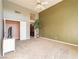 Bright bedroom with high ceilings, ceiling fan and neutral carpet at 2521 Seascape Dr, Las Vegas, NV 89128