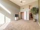 Bright bedroom with neutral carpet, ceiling fan, closet and high ceilings at 2521 Seascape Dr, Las Vegas, NV 89128
