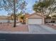 Charming single-story home with a well-maintained front yard and two car garage at 2521 Seascape Dr, Las Vegas, NV 89128