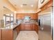 Well-equipped kitchen showcasing granite countertops, stainless steel appliances, and ample cabinet space for convenient storage at 2521 Seascape Dr, Las Vegas, NV 89128