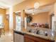 Modern kitchen with a stainless steel sink and views to the patio and seating area at 2521 Seascape Dr, Las Vegas, NV 89128