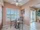 Inviting kitchen area with a round table and chairs, complemented by plantation shutters and stylish decor at 2521 Seascape Dr, Las Vegas, NV 89128