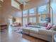 Bright living room with an expansive sectional sofa, and seamless flow to adjacent seating area at 2521 Seascape Dr, Las Vegas, NV 89128