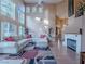 Open-concept living area features soaring ceilings, fireplace, and a large sectional sofa at 2521 Seascape Dr, Las Vegas, NV 89128