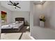 Neutral bedroom with bed, recessed wall with shelving for decorations and ample natural light at 2548 Faiss Dr, Las Vegas, NV 89134