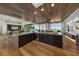 Open-concept kitchen with stainless steel appliances, island, and hardwood floors at 2548 Faiss Dr, Las Vegas, NV 89134