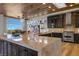 Spacious kitchen boasts a large island with seating, stainless steel appliances, and wooden ceiling at 2548 Faiss Dr, Las Vegas, NV 89134