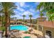 An aerial view of the community pool area with palm trees, seating, and beautiful landscaping at 2555 Hampton Rd # 9307, Henderson, NV 89052