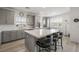 Bright kitchen showcasing stainless appliances, modern cabinets, white marble countertops, and an island with stool seating at 2555 Hampton Rd # 9307, Henderson, NV 89052