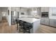 Modern kitchen features stainless appliances, white marble counters, and a large center island with bar stool seating at 2555 Hampton Rd # 9307, Henderson, NV 89052