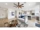 Bright, open living room connected to a modern kitchen with bar stool seating at 2555 Hampton Rd # 9307, Henderson, NV 89052