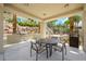 Outdoor kitchen area features a built-in grill, table with seating, and views of the landscaped community at 2555 Hampton Rd # 9307, Henderson, NV 89052