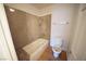 Bathroom with shower and tub featuring tiled walls, toilet, and wood floors at 2606 S Durango Dr # 165, Las Vegas, NV 89117