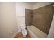 A full bathroom features a shower and bathtub combo along with a toilet and wood style flooring at 2606 S Durango Dr # 165, Las Vegas, NV 89117