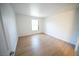 Bedroom with wood floors and a window, offering a cozy and comfortable retreat at 2606 S Durango Dr # 165, Las Vegas, NV 89117
