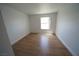 This bedroom features wood style flooring and a window to allow for natural lighting and ventilation at 2606 S Durango Dr # 165, Las Vegas, NV 89117