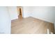 This bedroom features wood style flooring and access to an en suite bathroom, as well as natural lighting at 2606 S Durango Dr # 165, Las Vegas, NV 89117