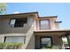 Close up of the exterior showing second story deck with railings and window details at 2606 S Durango Dr # 165, Las Vegas, NV 89117
