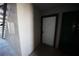 Hallway leading to unit, door and staircase at 2606 S Durango Dr # 165, Las Vegas, NV 89117