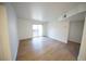 Bright living room with wood floors and sliding glass door to balcony, creating a light and airy space at 2606 S Durango Dr # 165, Las Vegas, NV 89117