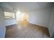 Open-concept living area with wood floors seamlessly connects to the kitchen, perfect for modern living at 2606 S Durango Dr # 165, Las Vegas, NV 89117