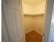 Spacious walk-in closet with ample storage space and shelving with wood floors at 2606 S Durango Dr # 165, Las Vegas, NV 89117