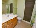 Bathroom featuring a single sink vanity and shower with curtain, and window shade at 2787 Sunken Ship St, Laughlin, NV 89029