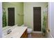 Bathroom featuring a single sink vanity and shower with curtain, and window shade at 2787 Sunken Ship St, Laughlin, NV 89029