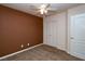 Cozy bedroom features a ceiling fan, carpet flooring, and a closet with sliding doors at 2787 Sunken Ship St, Laughlin, NV 89029