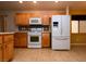 Bright kitchen featuring light wood cabinetry, updated appliances, tile backsplash, and ample counter space at 2787 Sunken Ship St, Laughlin, NV 89029