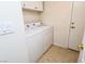 Laundry room with tile flooring and white washer and dryer at 2787 Sunken Ship St, Laughlin, NV 89029