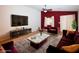A stylish living room features designer furnishings, a plush rug, and a sleek entertainment center for modern comfort at 2787 Sunken Ship St, Laughlin, NV 89029