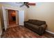 Living room with hardwood floors, ceiling fan, and neutral paint at 2787 Sunken Ship St, Laughlin, NV 89029