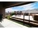 Inviting outdoor patio featuring stone accents, artificial turf, and scenic views at 2787 Sunken Ship St, Laughlin, NV 89029