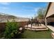 Outdoor patio with seating area, artificial turf, and a view of the surrounding landscape at 2787 Sunken Ship St, Laughlin, NV 89029