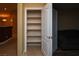 Well-lit pantry with white shelves and tile flooring offers ample storage space at 2787 Sunken Ship St, Laughlin, NV 89029