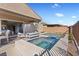 This backyard features a pool, spa, covered patio, and an outdoor television at 305 Via Del Duomo, Henderson, NV 89011
