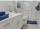 Bathroom features a single sink, toilet and a shower with sliding glass doors and safety bars at 305 Via Del Duomo, Henderson, NV 89011