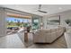 Open living room with sliding glass doors to backyard, modern decor, and open floor plan at 305 Via Del Duomo, Henderson, NV 89011