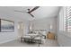 Serene primary bedroom with a large window, comfortable seating, and neutral color palette at 305 Via Del Duomo, Henderson, NV 89011