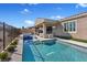 Sparkling pool with a Baja shelf and inviting covered patio, perfect for relaxing outdoors at 305 Via Del Duomo, Henderson, NV 89011