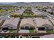 This aerial view shows the home's backyard, desert landscaping, and surrounding neighborhood at 3084 Porte La Paz Ave, Henderson, NV 89044
