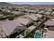This aerial view shows the home's backyard, swimming pool, and surrounding neighborhood at 3084 Porte La Paz Ave, Henderson, NV 89044