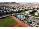 Aerial view showcasing the community with pool, baseball field, and houses at 3084 Porte La Paz Ave, Henderson, NV 89044