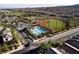 Aerial view showcasing the community pool, baseball fields, with houses at 3084 Porte La Paz Ave, Henderson, NV 89044