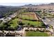Aerial view of a community park with a baseball field surrounded by residences and desert mountains at 3084 Porte La Paz Ave, Henderson, NV 89044