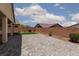 This backyard has a paver patio with artificial turf and desert landscaping at 3084 Porte La Paz Ave, Henderson, NV 89044