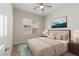 Bedroom with a large bed, bedside tables, and a window at 3084 Porte La Paz Ave, Henderson, NV 89044