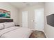 Bedroom with a large bed, nightstand, and wall-mounted television at 3084 Porte La Paz Ave, Henderson, NV 89044