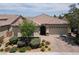 This home has a red tile roof, desert landscaping, and a two car garage at 3084 Porte La Paz Ave, Henderson, NV 89044